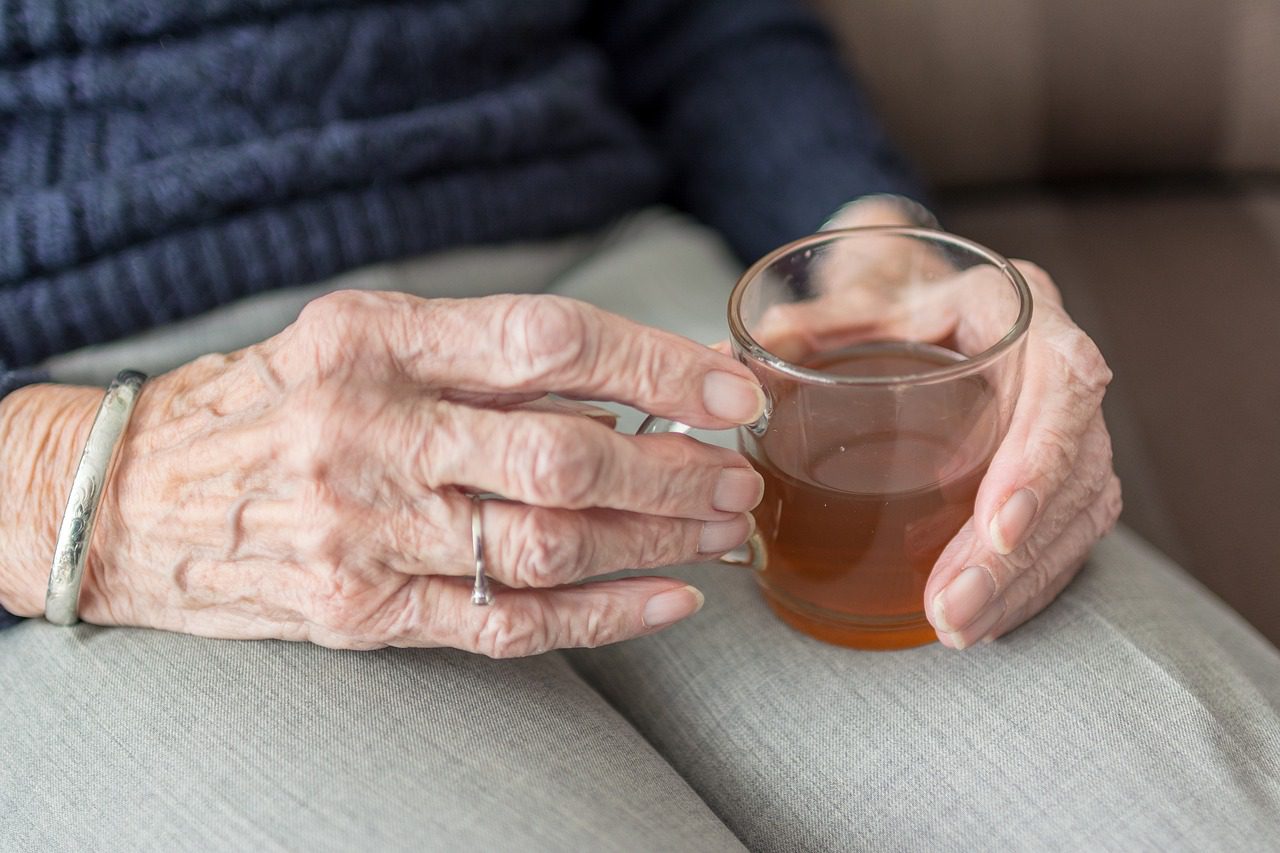 Old Woman drinking Tea